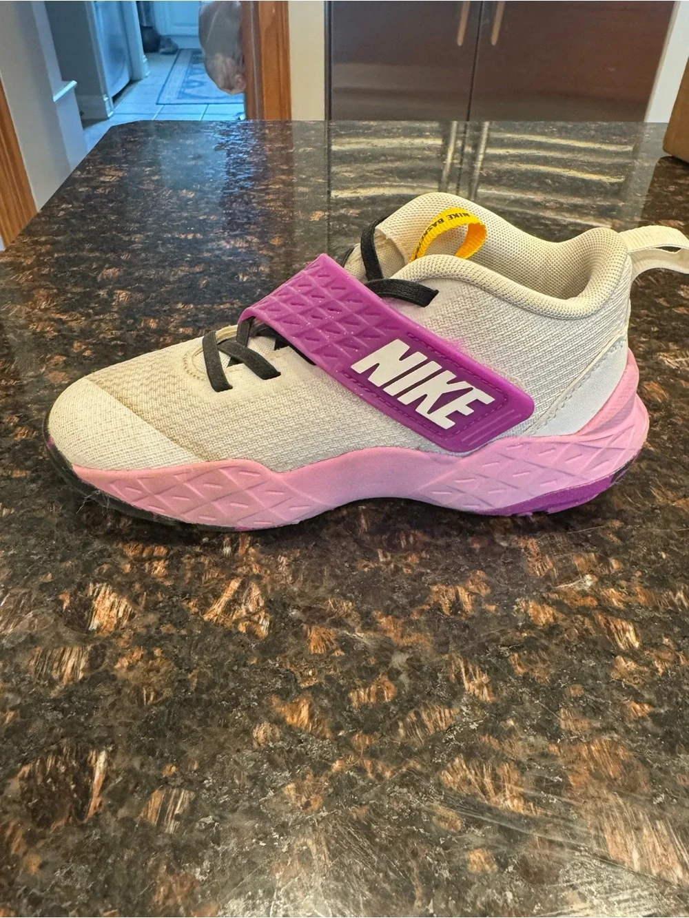 Nike Kids White basketball sneakers with Pink and Purple Accents